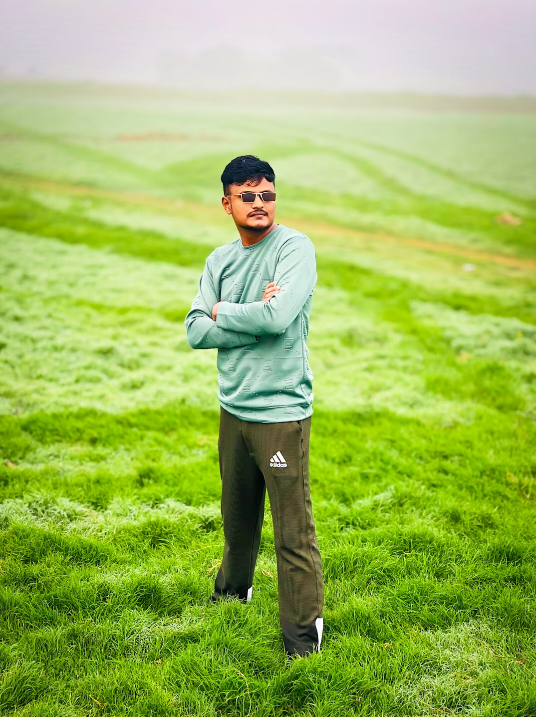 Middle-aged Danish farmer standing in a field