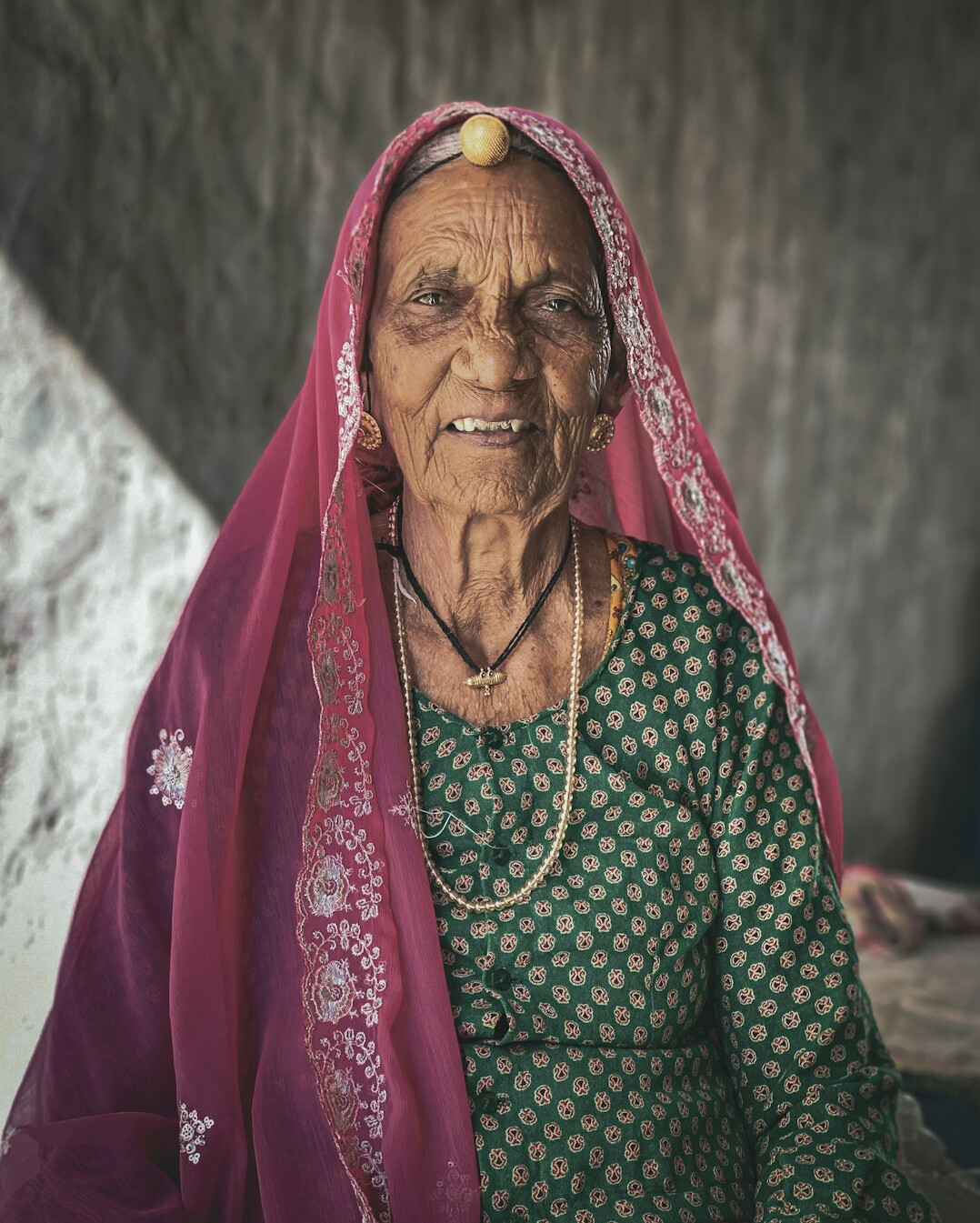 elderly woman storytelling in village