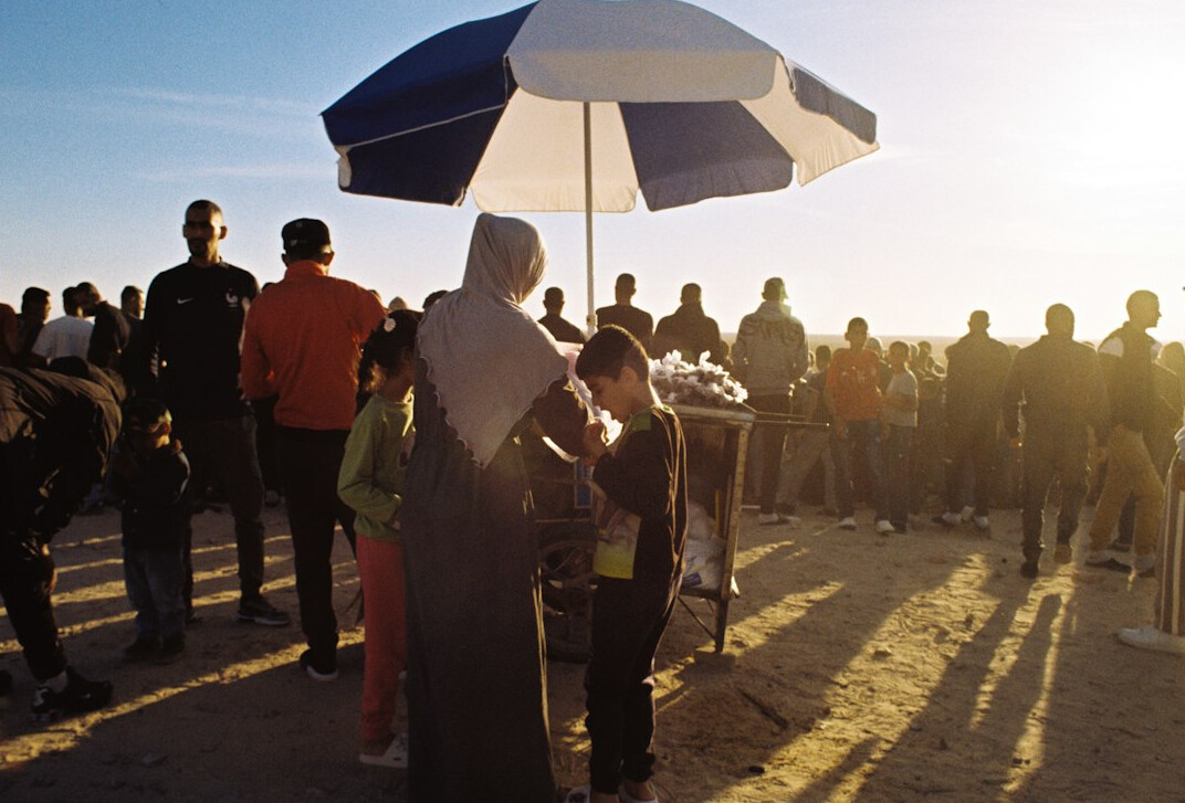 photographer interviewing locals